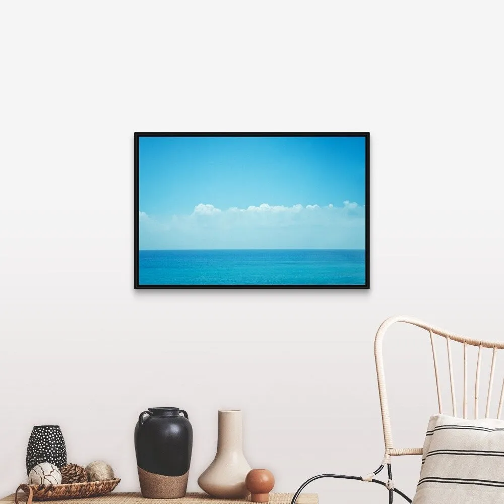 "Blue ocean with sky and clouds." Black Float Frame Canvas Art