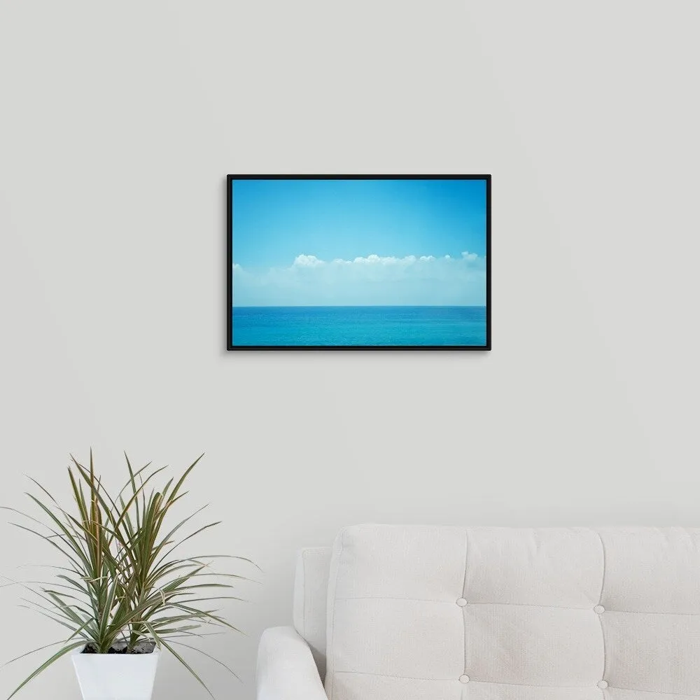 "Blue ocean with sky and clouds." Black Float Frame Canvas Art