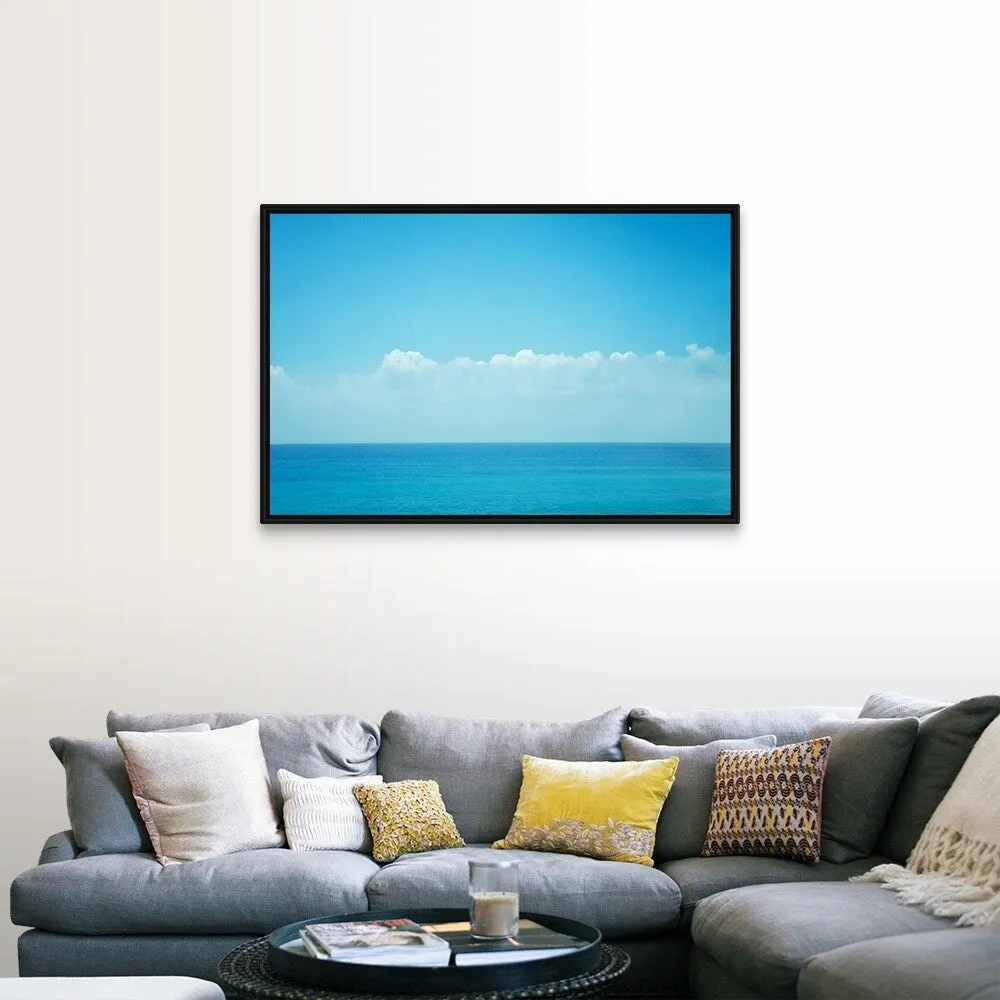 "Blue ocean with sky and clouds." Black Float Frame Canvas Art